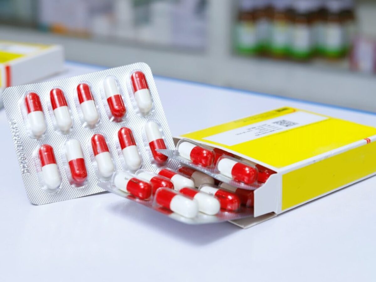 white and red medication pill blister pack