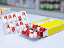 white and red medication pill blister pack