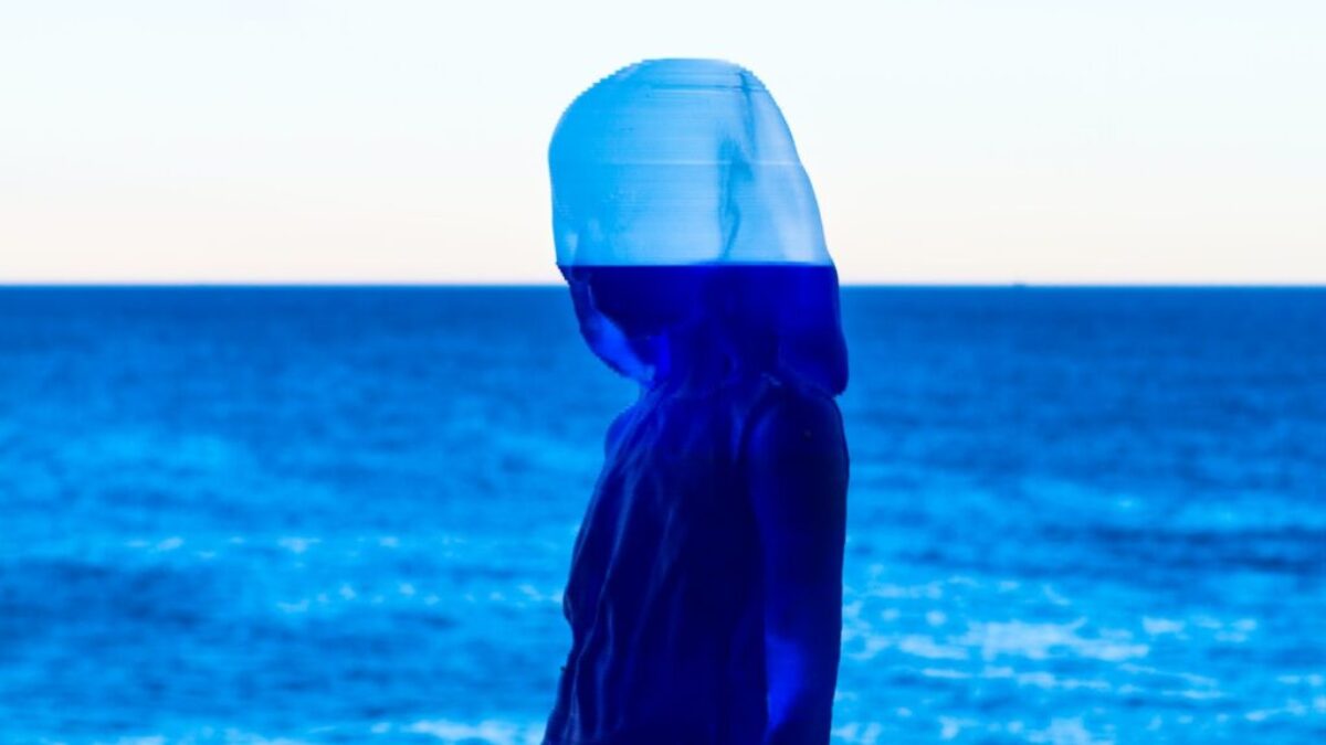 painting of woman and calm ocean