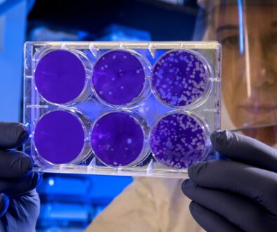 woman holding laboratory appratus