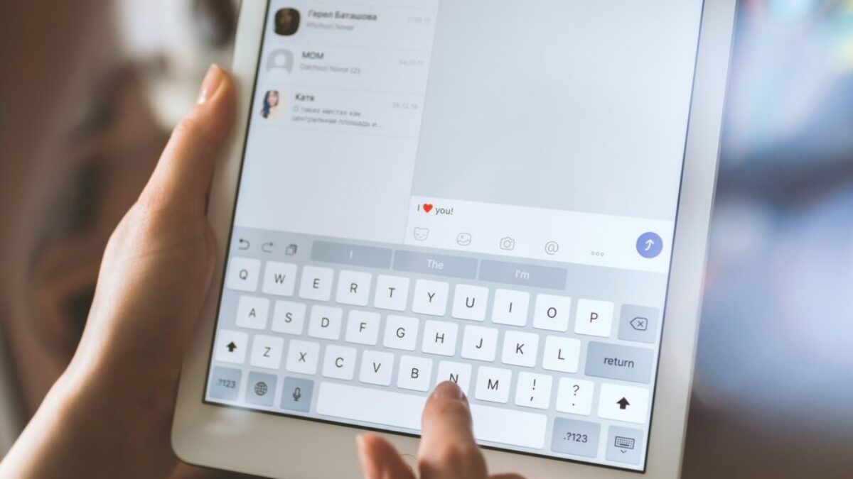 person using white iPad
