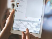person using white iPad