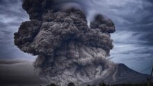 volcano eruption during daytime