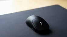 black cordless computer mouse on black surface