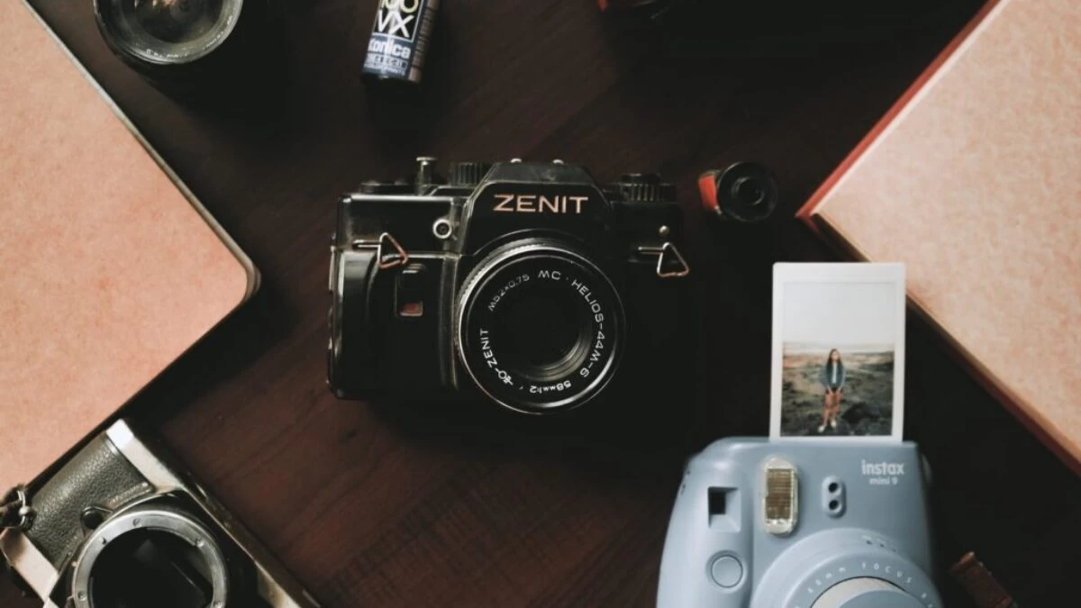black and silver nikon camera on brown wooden table