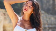 woman in white spaghetti strap top