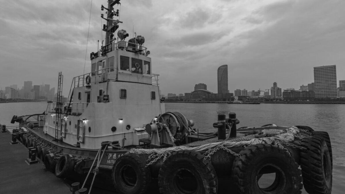 grayscale photo of a boat on a body of water