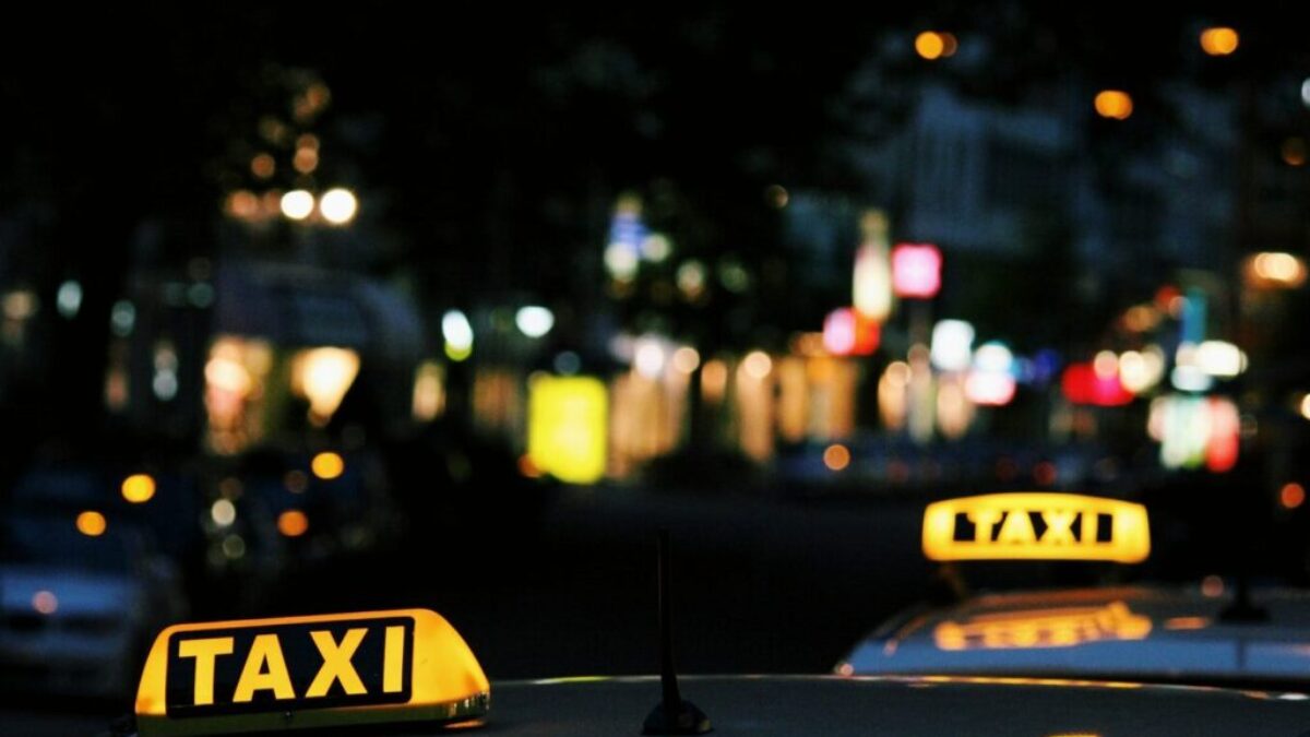 shallow focus photography of Taxi signage
