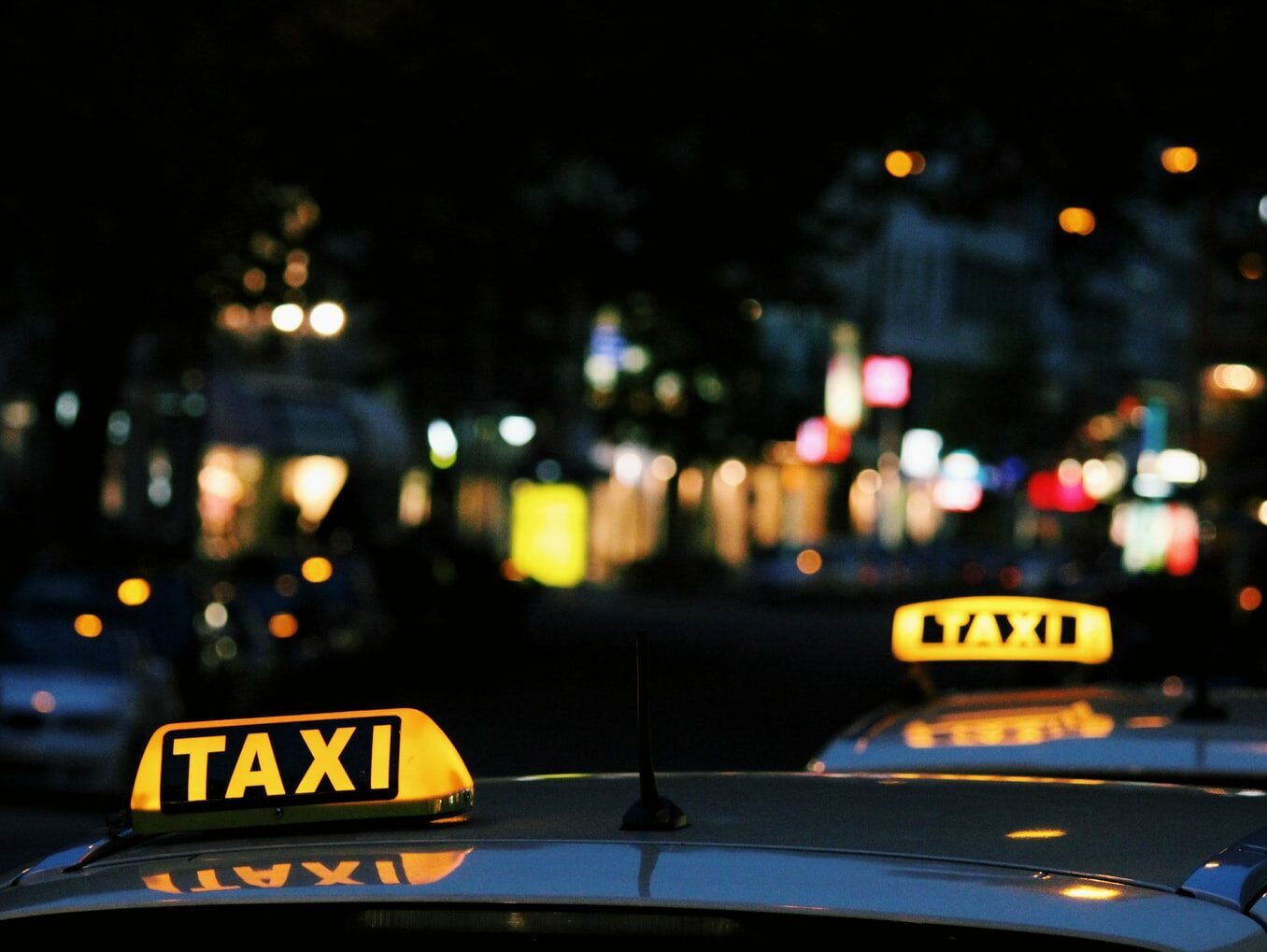 shallow focus photography of Taxi signage