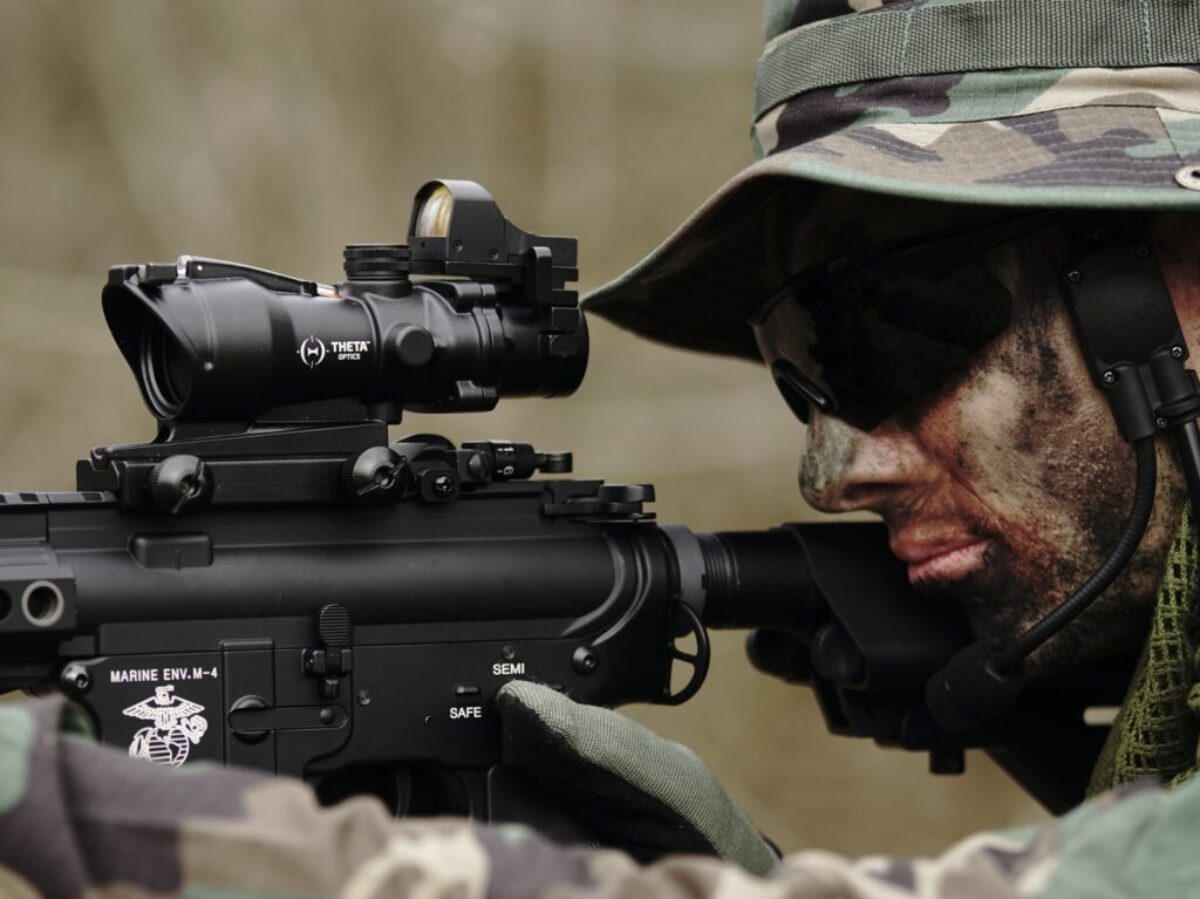 man in woodland camouflage uniform using sniper rifle