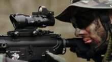 man in woodland camouflage uniform using sniper rifle