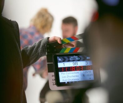 person holding clapperboard