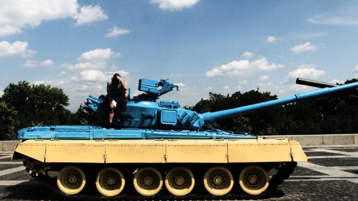 person sitting on tank
