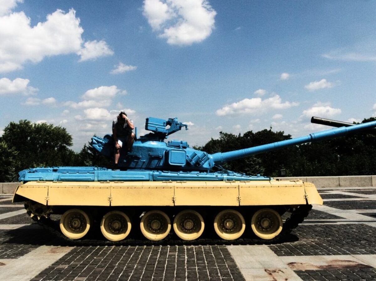 person sitting on tank