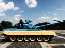 person sitting on tank