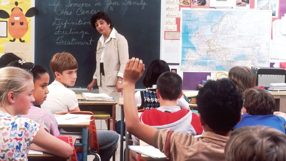 woman standing in front of children