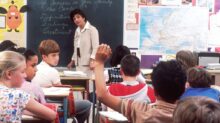 woman standing in front of children