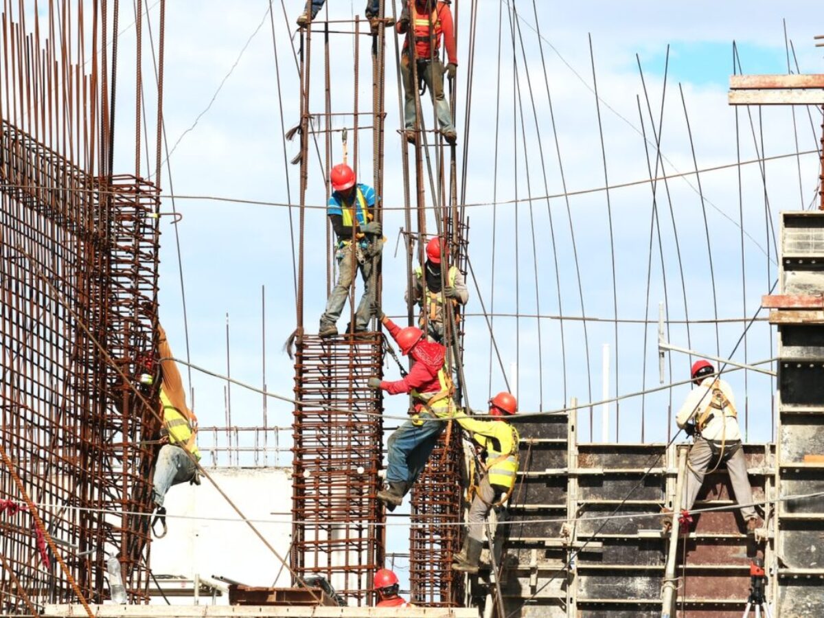 people working on building during daytime