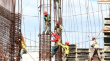 people working on building during daytime