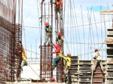 people working on building during daytime