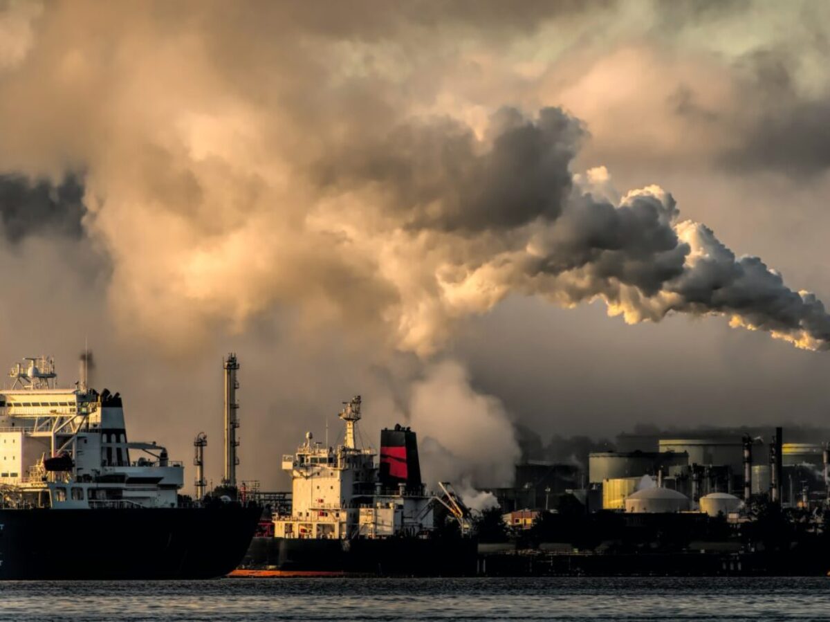white and black ship on sea under white clouds