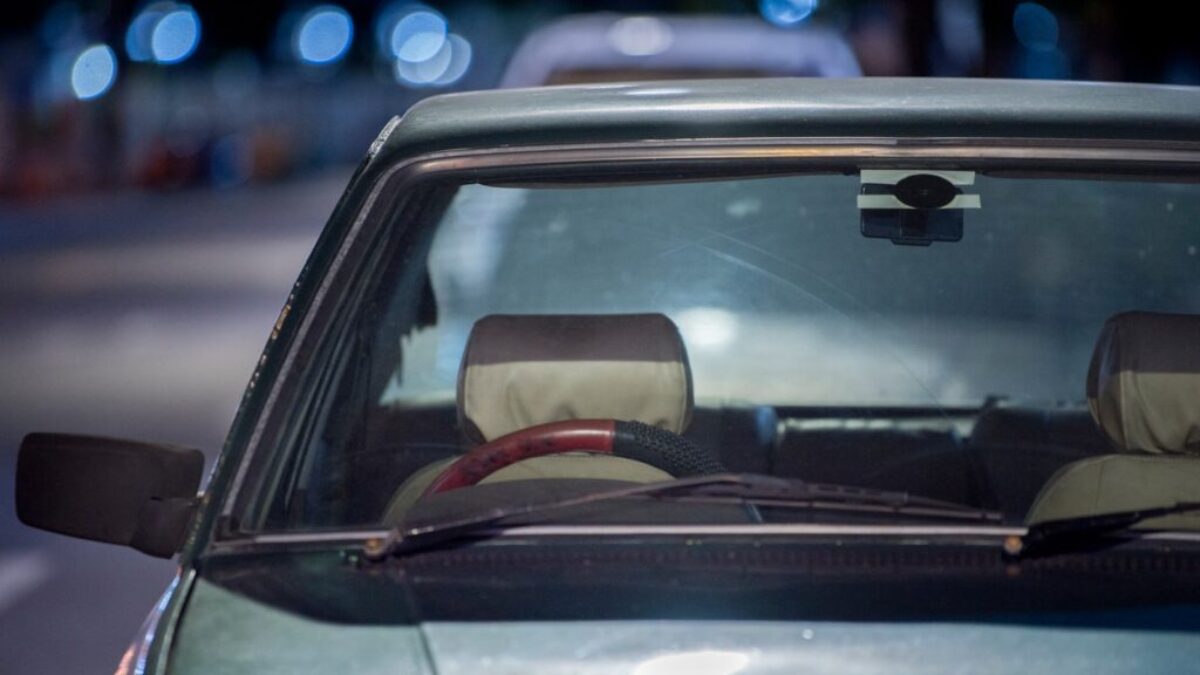selective focus photograph of blue vehicle