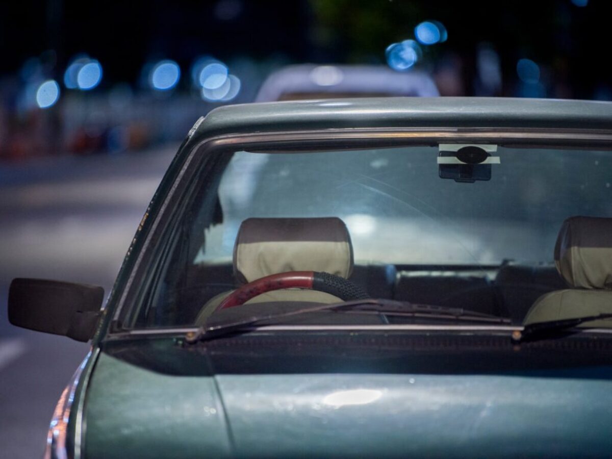 selective focus photograph of blue vehicle