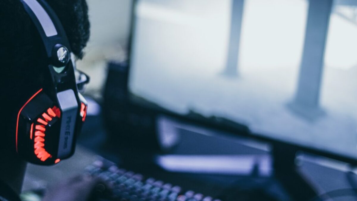 person wearing orange and black headphones