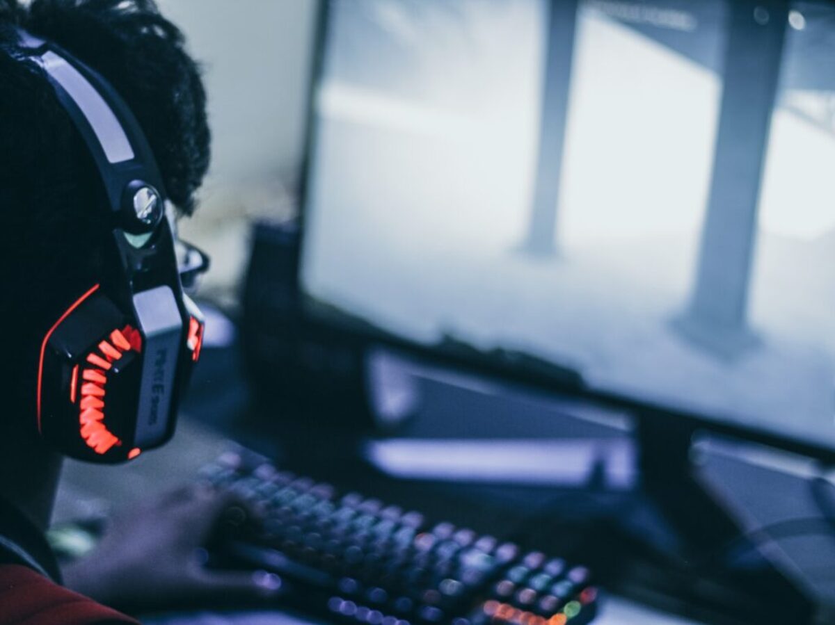 person wearing orange and black headphones