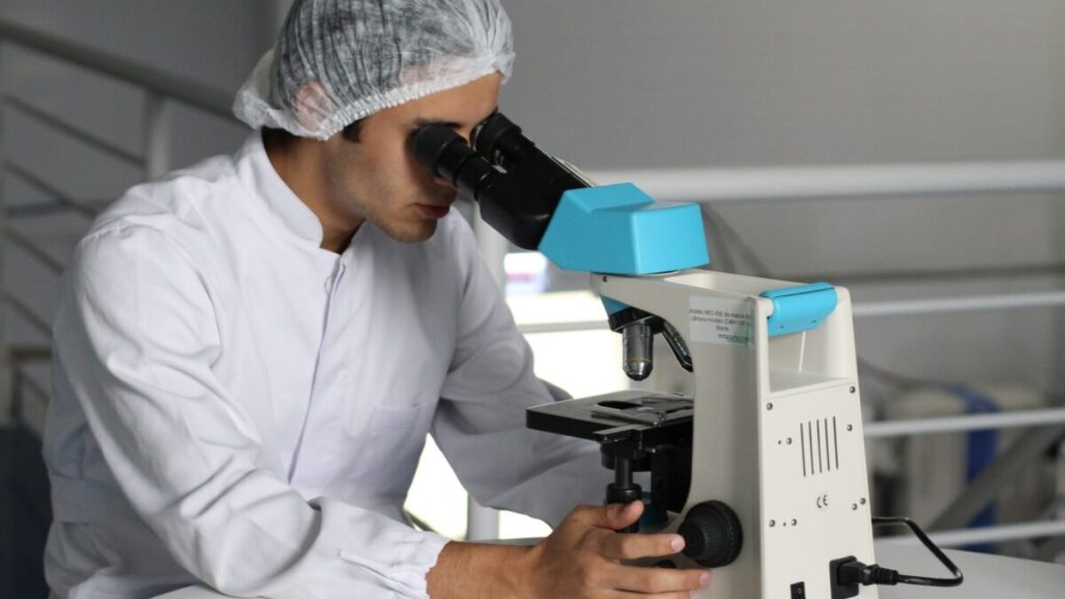 man sight on white microscope