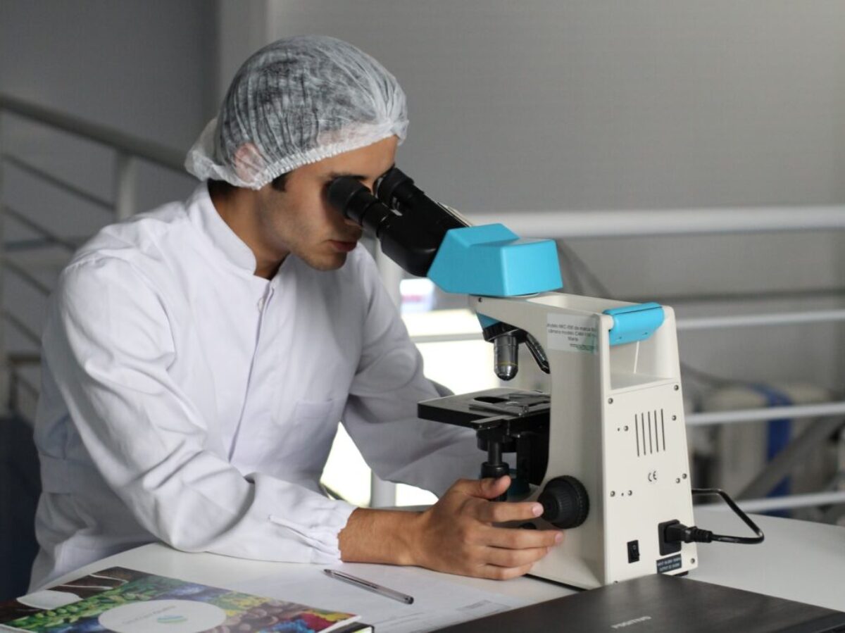 man sight on white microscope
