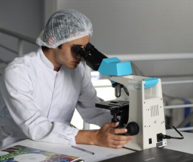 man sight on white microscope