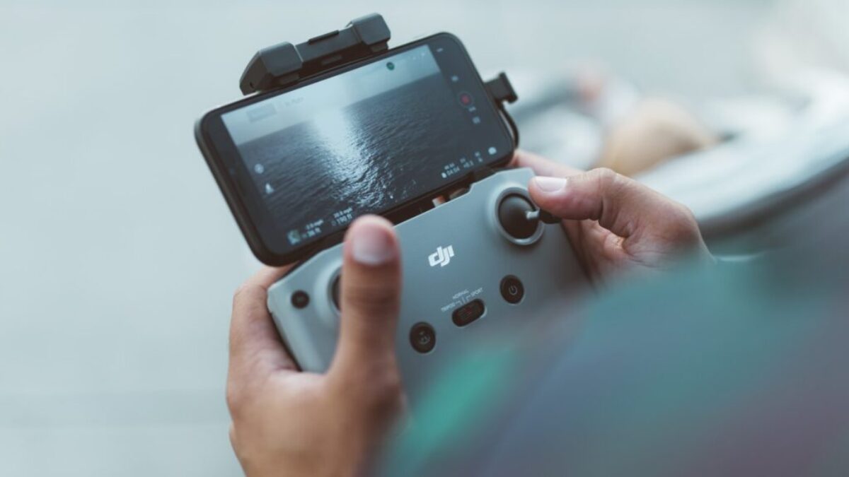 person holding red and black nintendo switch