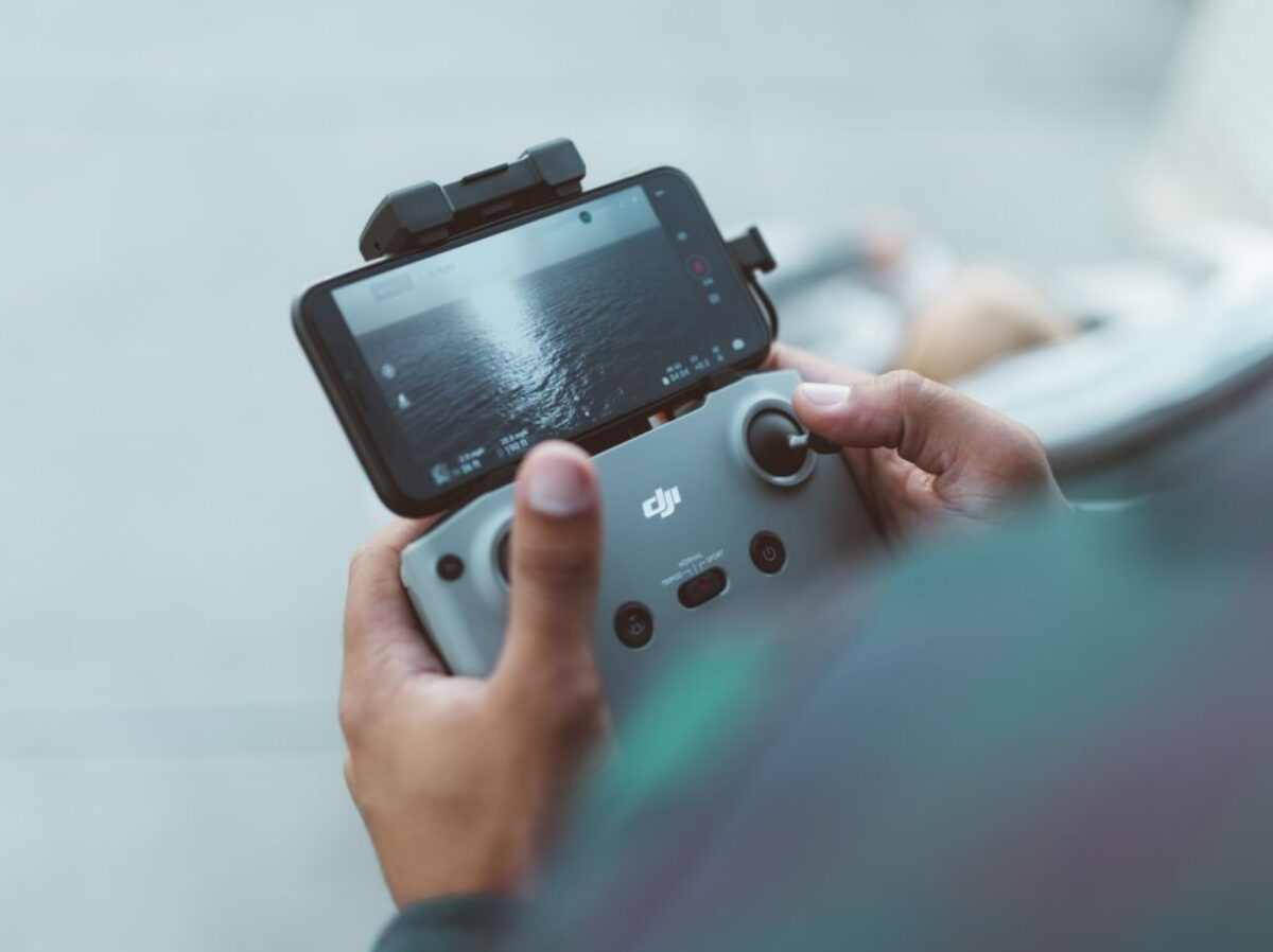 person holding red and black nintendo switch