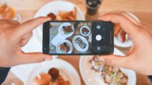 person taking picture of the foods