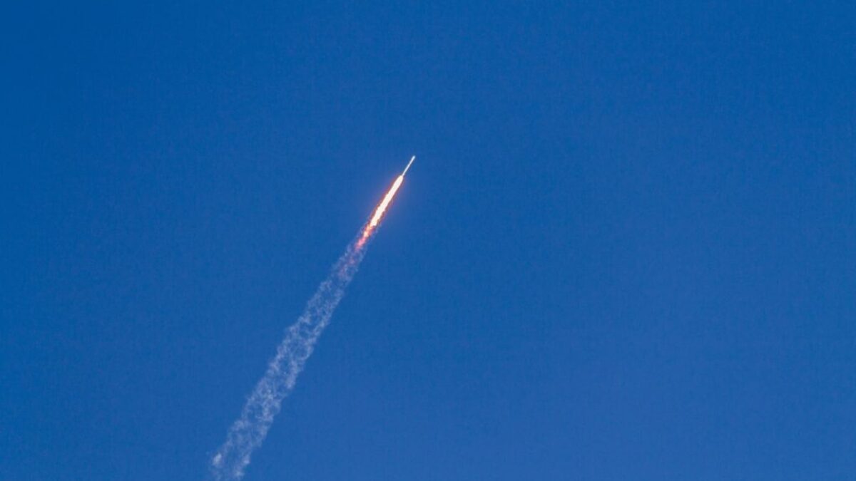 flying rocket during daytime