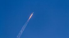 flying rocket during daytime