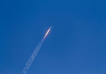 flying rocket during daytime