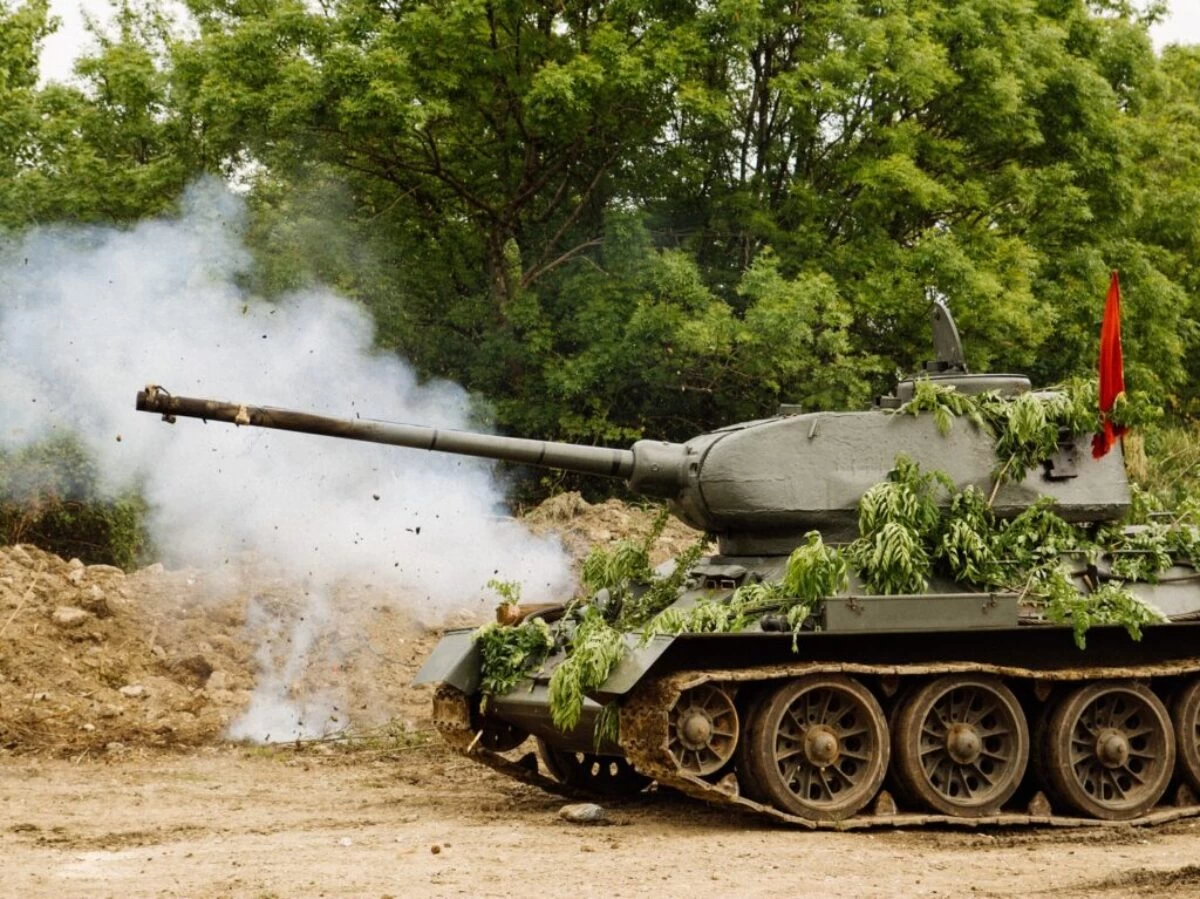 green battle tank on brown soil