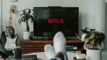 black flat screen tv turned on displaying 11