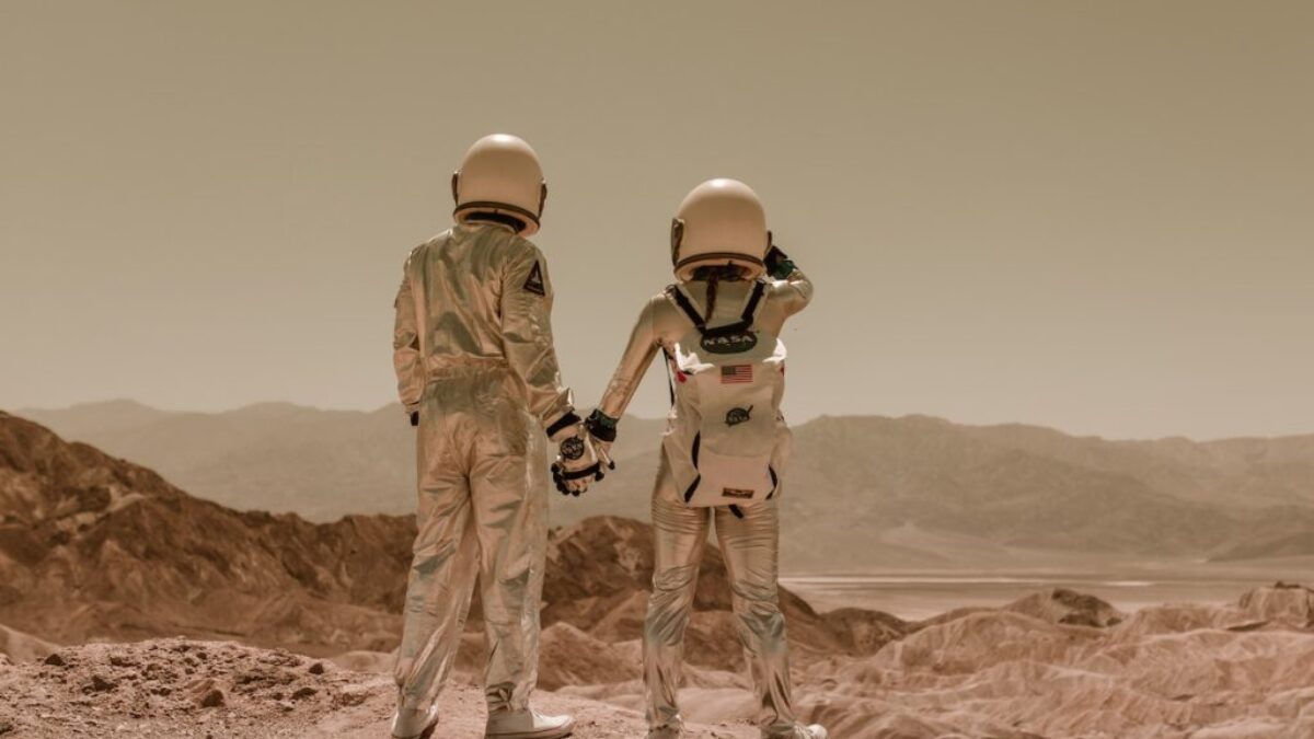 Back View of Astronauts Holding Hands