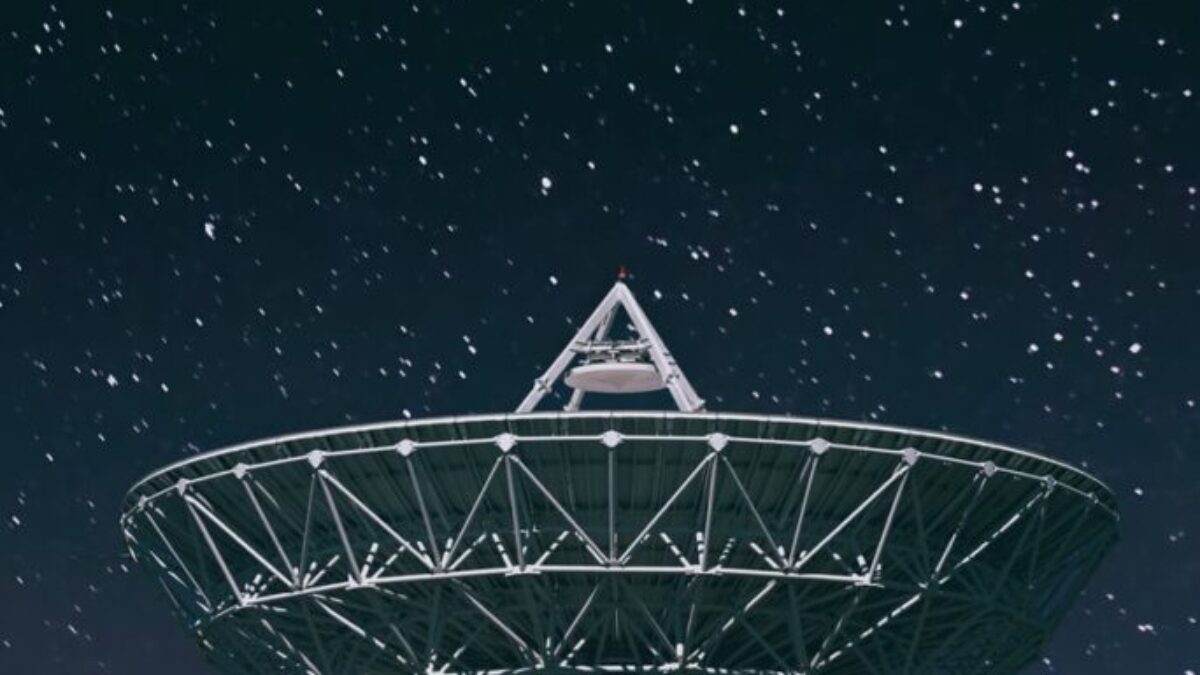 white satellite dish under starry night