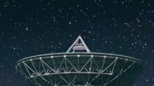 white satellite dish under starry night