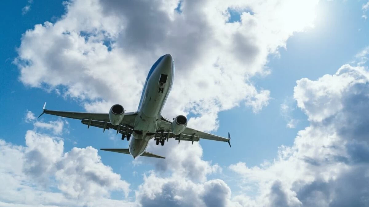 low-angle photography of airliner during flight