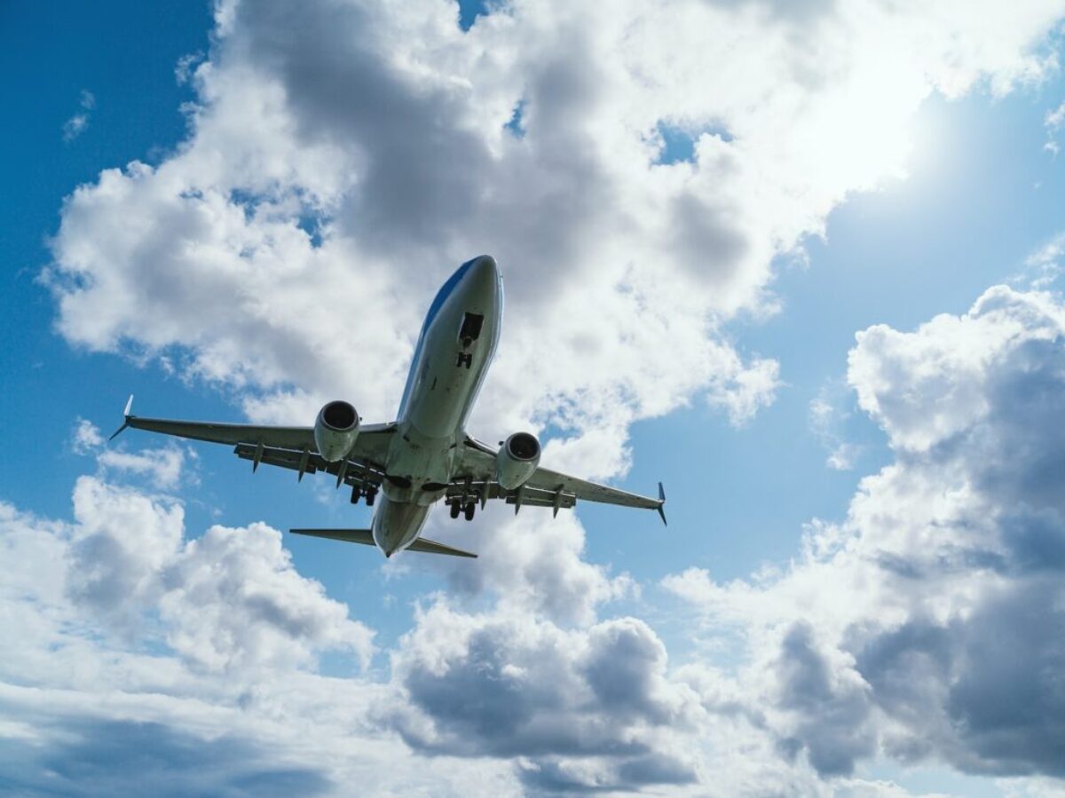 low-angle photography of airliner during flight