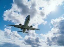 low-angle photography of airliner during flight