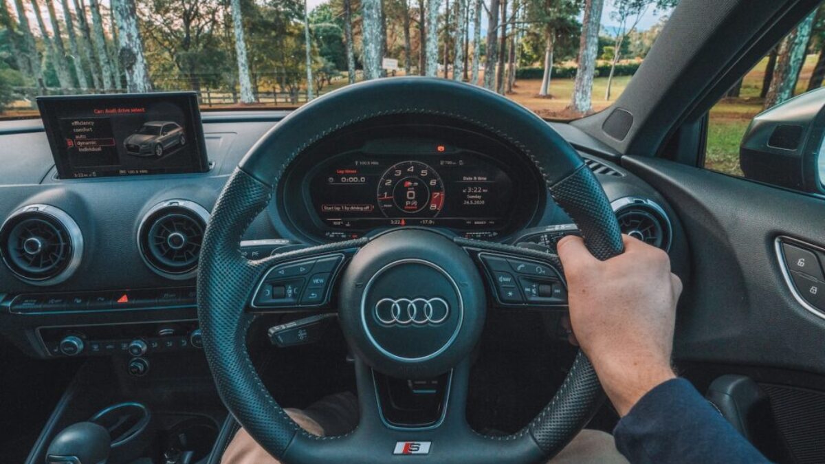 person driving car during daytime