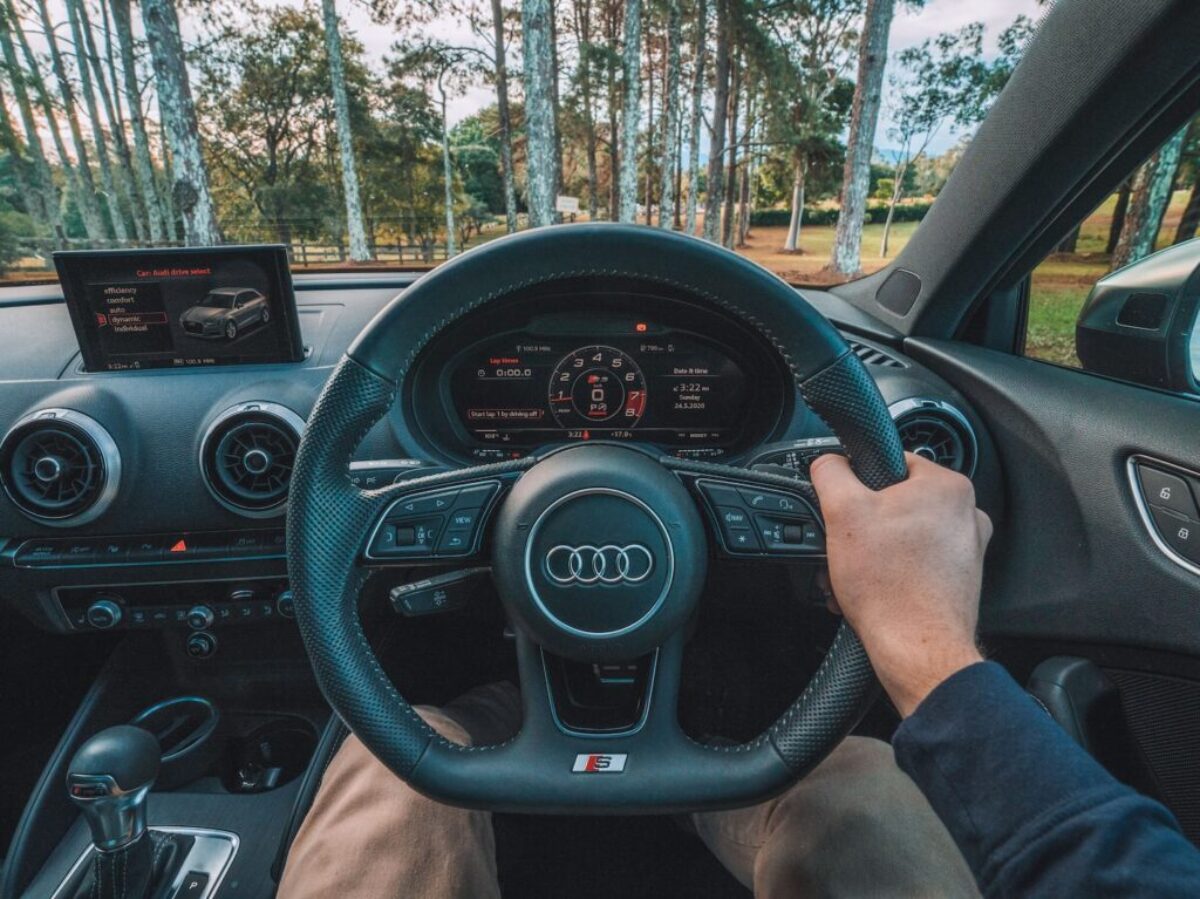 person driving car during daytime