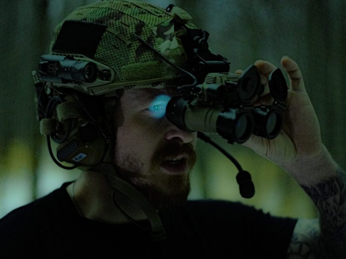 man in black crew neck shirt holding black dslr camera