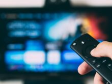 turned-on flat screen television